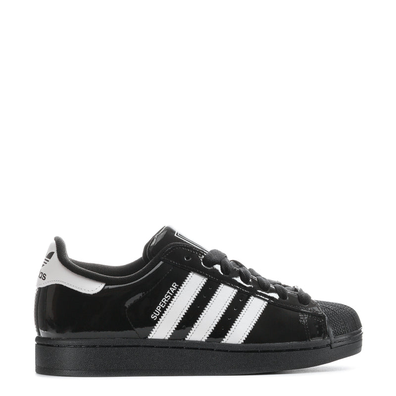 Youth low-top sneakers in black patent with white triple stripes and black laces