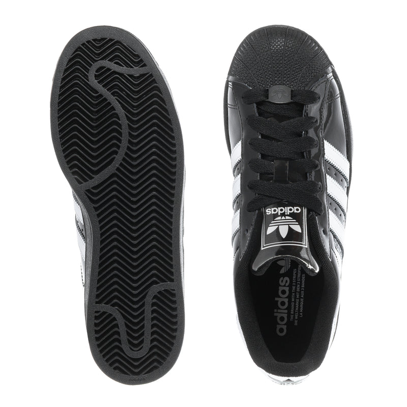 Youth sneaker outsoles with patterned tread, seen from underside