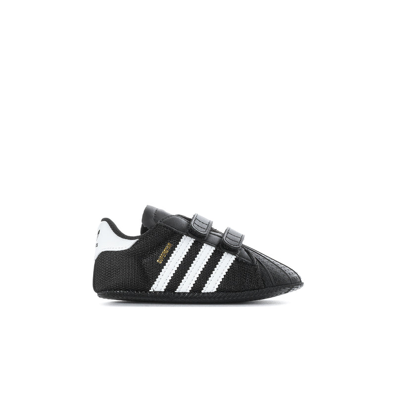 Infant black adidas Superstar sneaker with white three stripes and Velcro strap