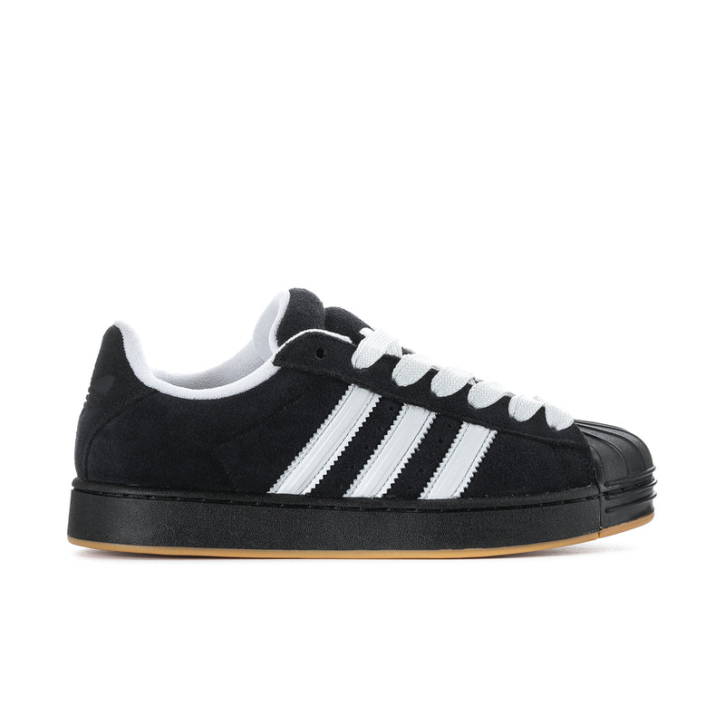 Black and white men's low-top sneakers with three stripe detail and gum sole.