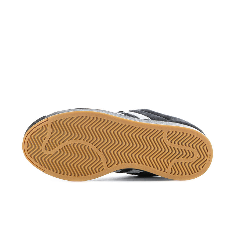 Bottom view of black and white men's sneakers with gum rubber tread outsole.