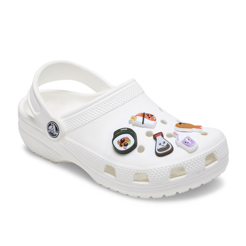 White Crocs clog decorated with five sushi-themed Jibbitz charms