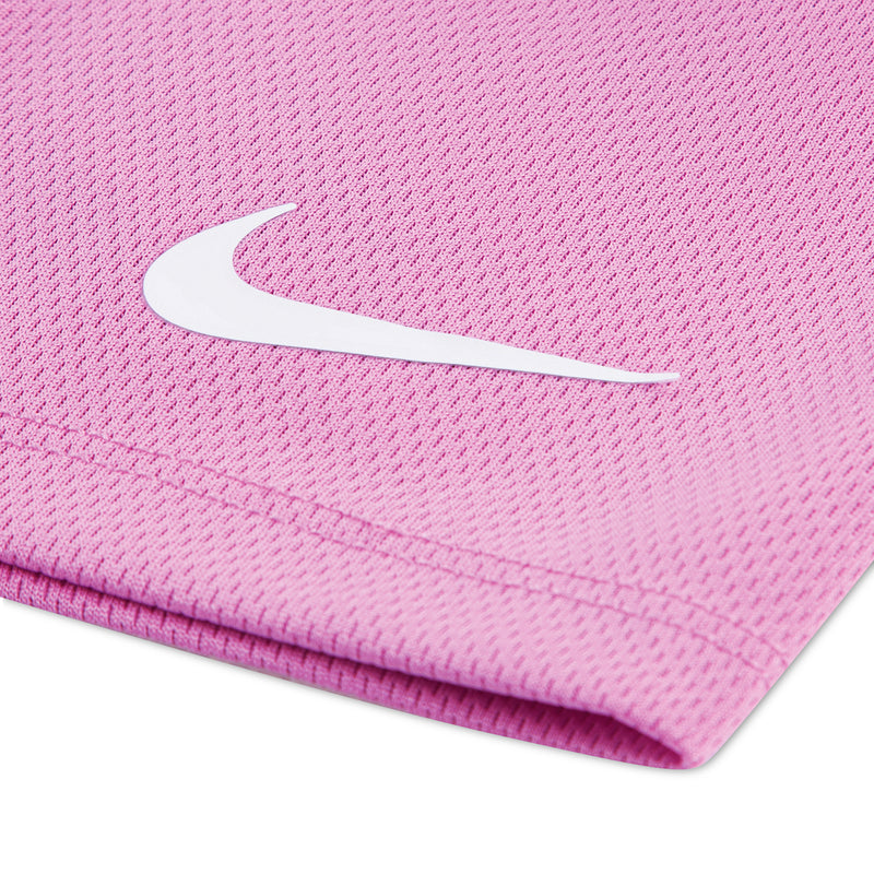 Light magenta toddler shorts with white Nike Swoosh on textured fabric