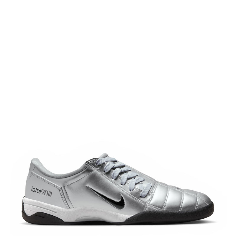 Metallic silver women’s lace-up athletic sneaker with black sole and side swoosh