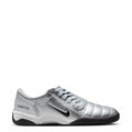 Metallic silver women’s lace-up athletic sneaker with black sole and side swoosh