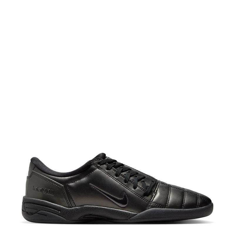 Women's T90 black lace-up sneakers with Nike swoosh, quilted leather-look upper.