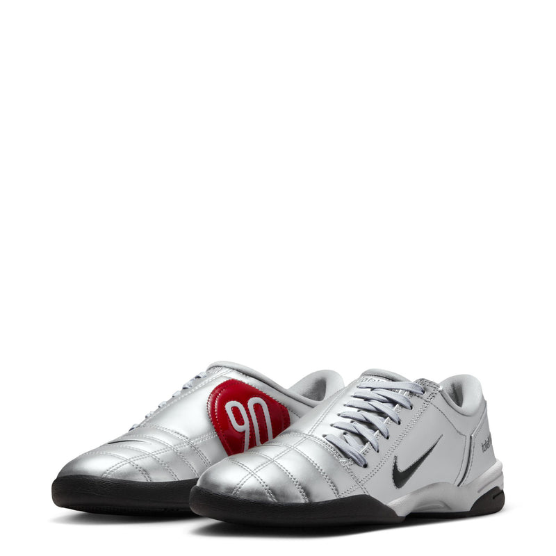 Metallic silver women’s lace-up sneakers with red '90' heel patch and side swoosh