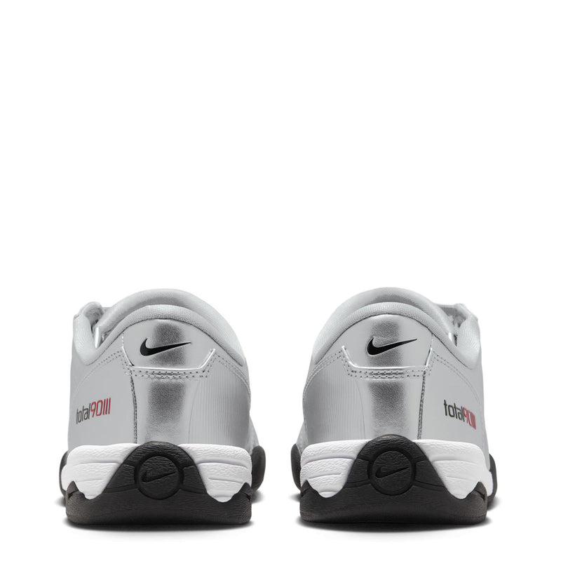 Silver women’s lace-up sneaker heel view with Nike logo and black traction wedge