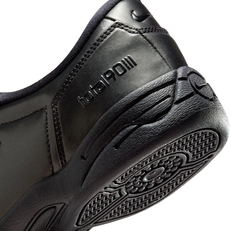 Women's T90 black sneaker outsole and side tread with circular grip pattern.