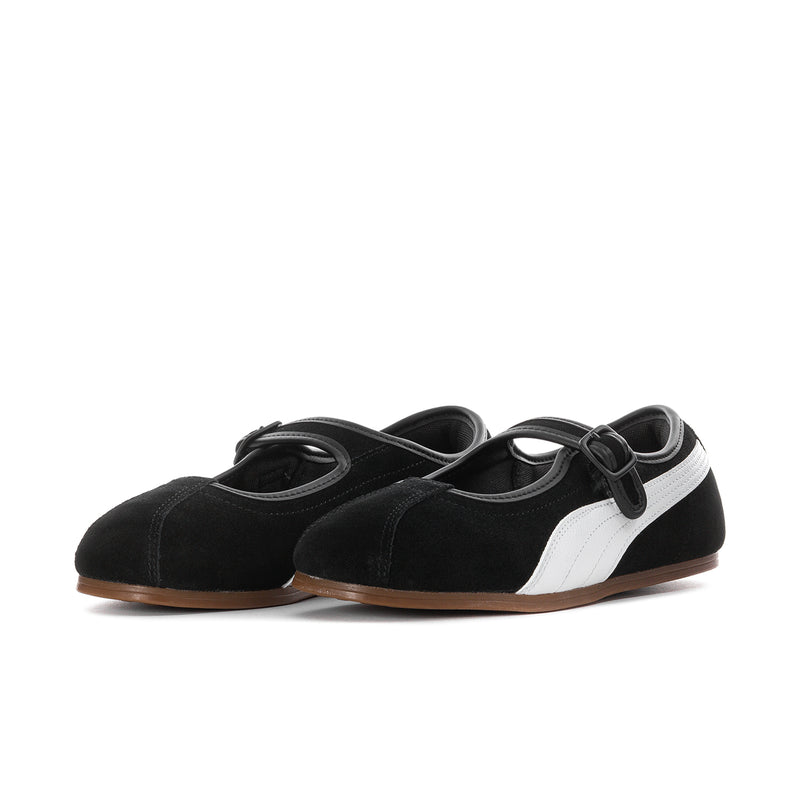 Women's black suede slip-on flats with white side panels and gum rubber sole.