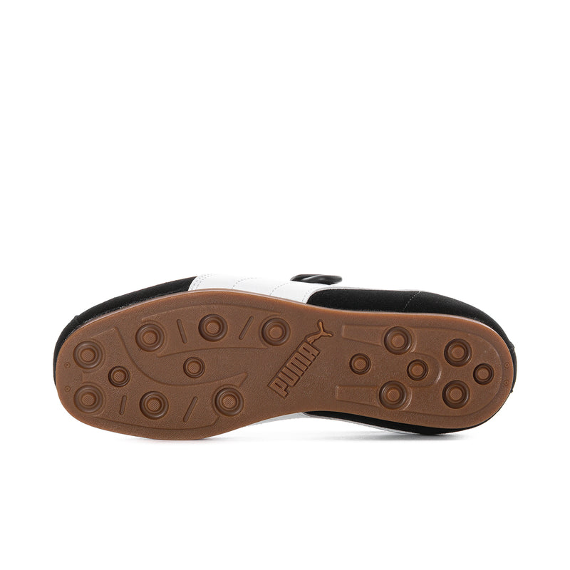 Gum rubber outsole for women's black suede flats with round traction tread.