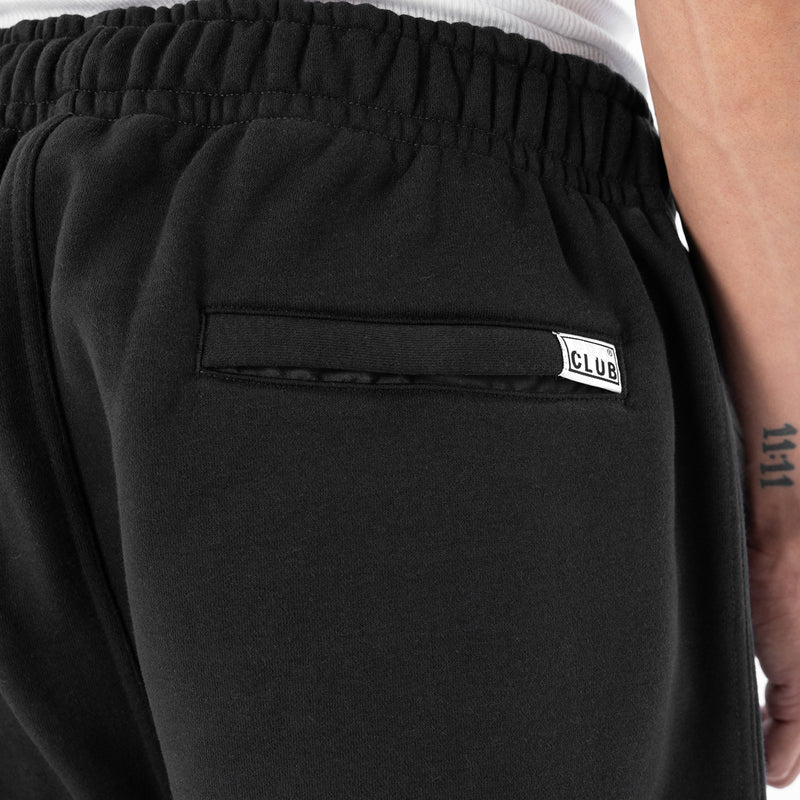 Men's black cargo fleece pants with 'CLUB' logo patch on side waistband pocket
