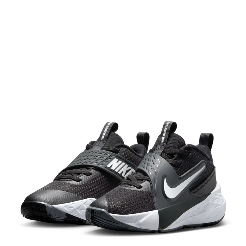 Kids Nike athletic shoe with black fabric upper and bold NIKE side logo