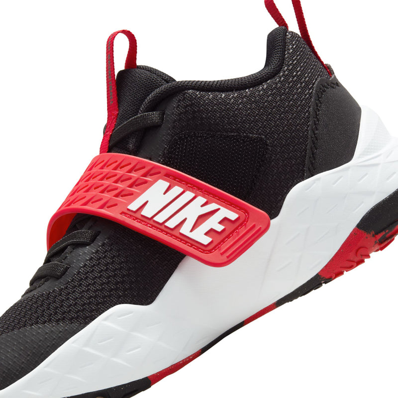 Kids' black and red athletic shoe with white swoosh on the strap and cushioned midsole.