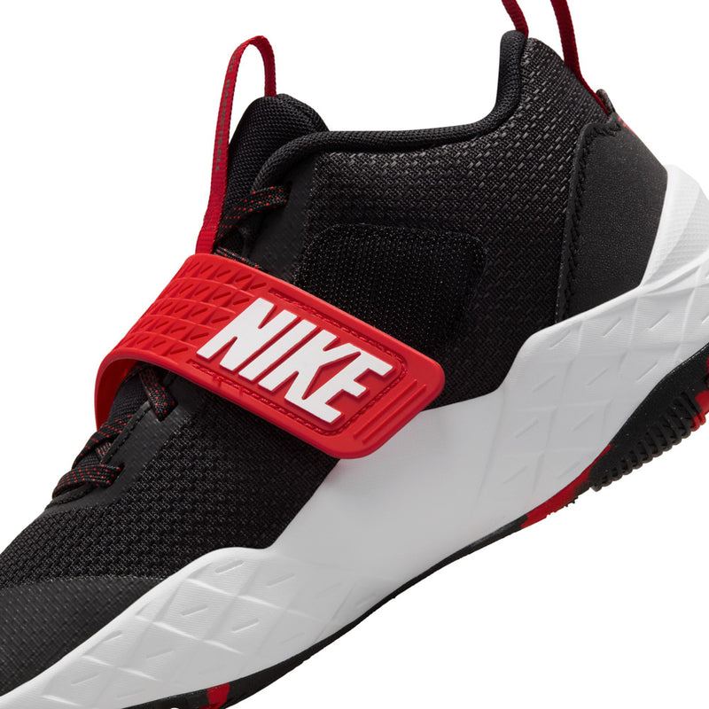 Youth sneaker side close-up, black mesh with red NIKE strap and white midsole