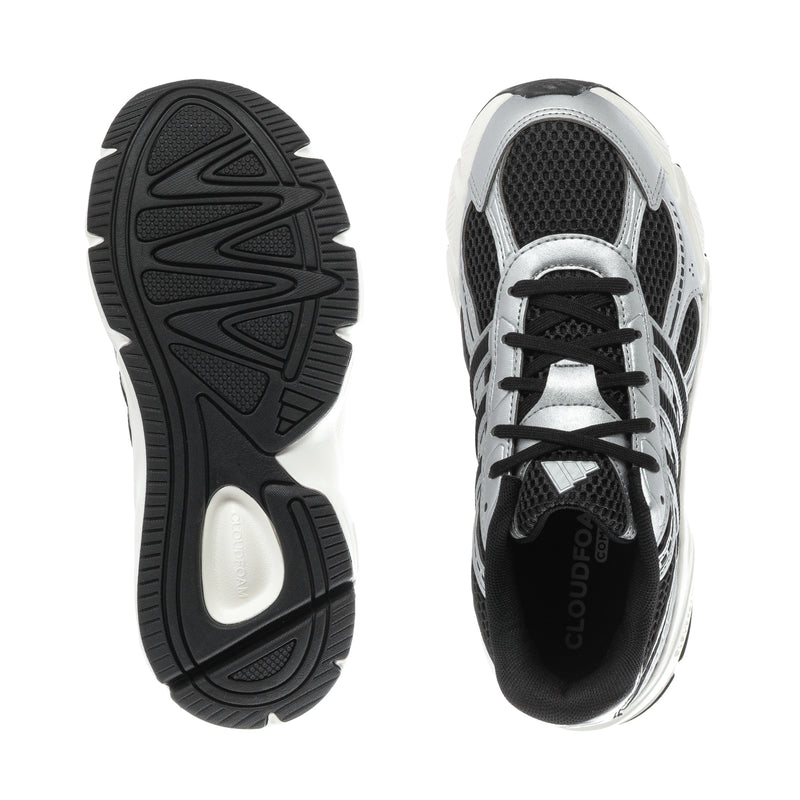 Black-and-white sneaker outsoles with tread and one shoe upper, mesh side panels