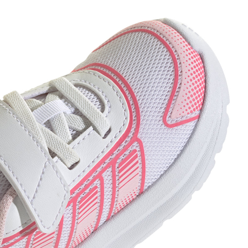 Toddler shoe upper close-up, white laces with pink mesh panels and stitched details