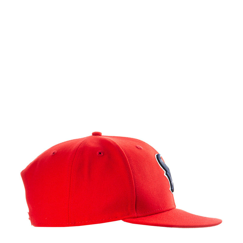 Red baseball cap side profile with small stitched logo patch