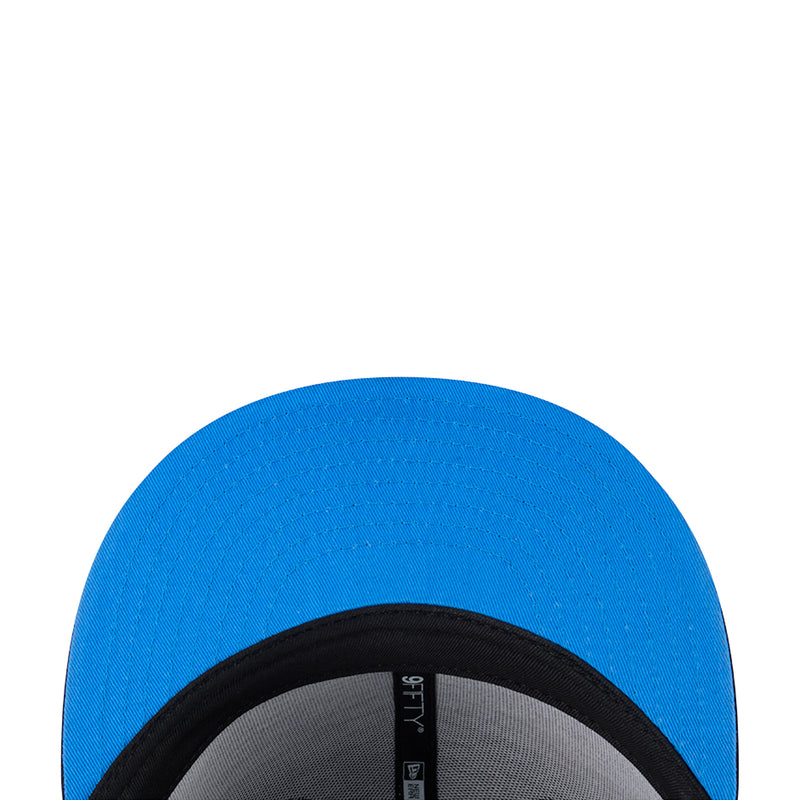 Blue cap lining with black elastic trim and gray interior sweatband