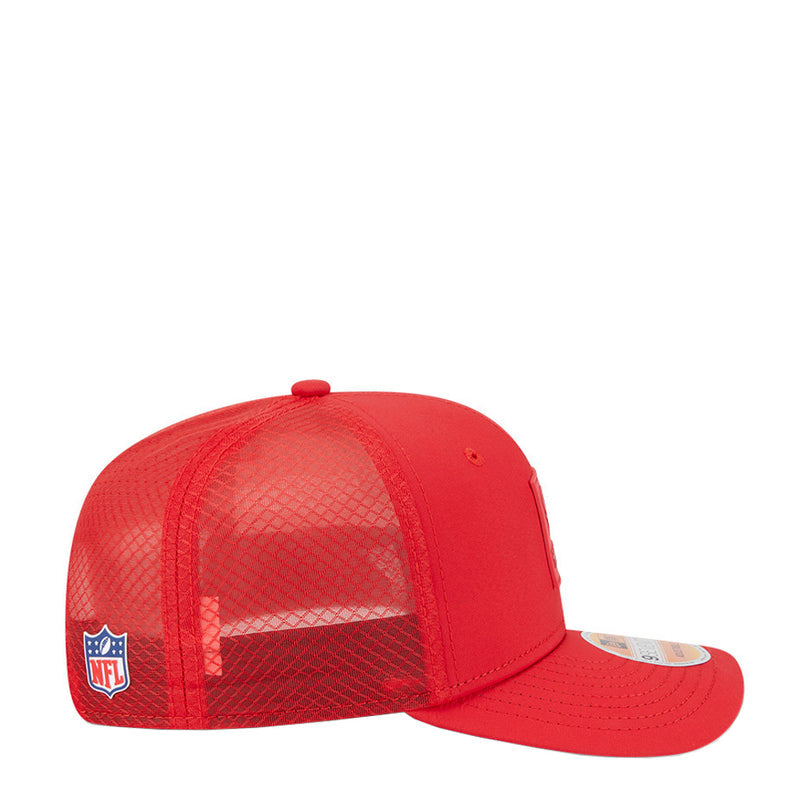 Red cap with mesh side panels, NFL shield patch, and curved brim