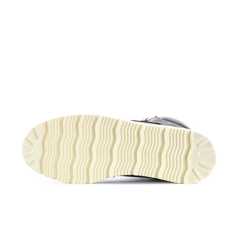 Cream rubber outsole with zigzag tread for dark brown moc-toe lace-up boot