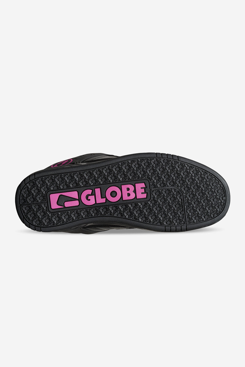 Bottom view of a black Tilt skate shoe with pink Globe logo and rugged tread pattern