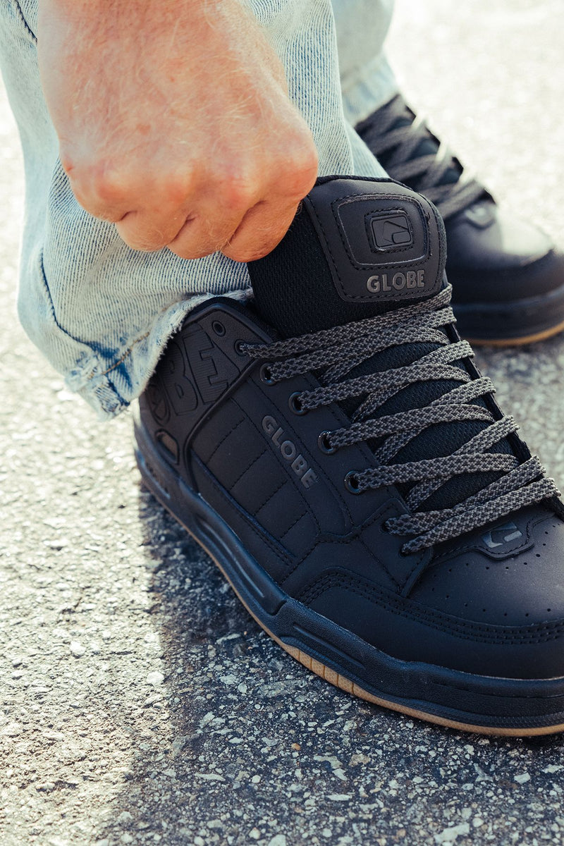 Close-up of Tilt upper showing laces and a padded tongue with Globe branding
