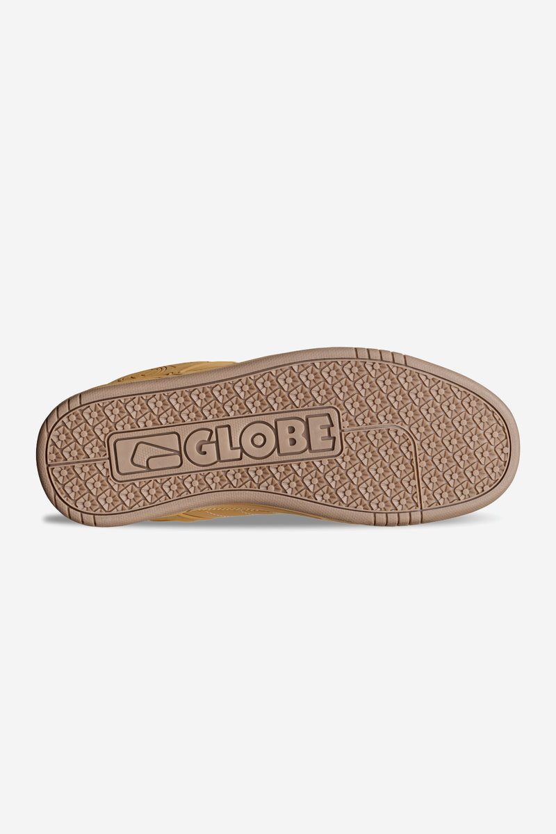 Bottom view of honey color Globe Tilt sneaker showing textured gum sole with pattern and Globe logo