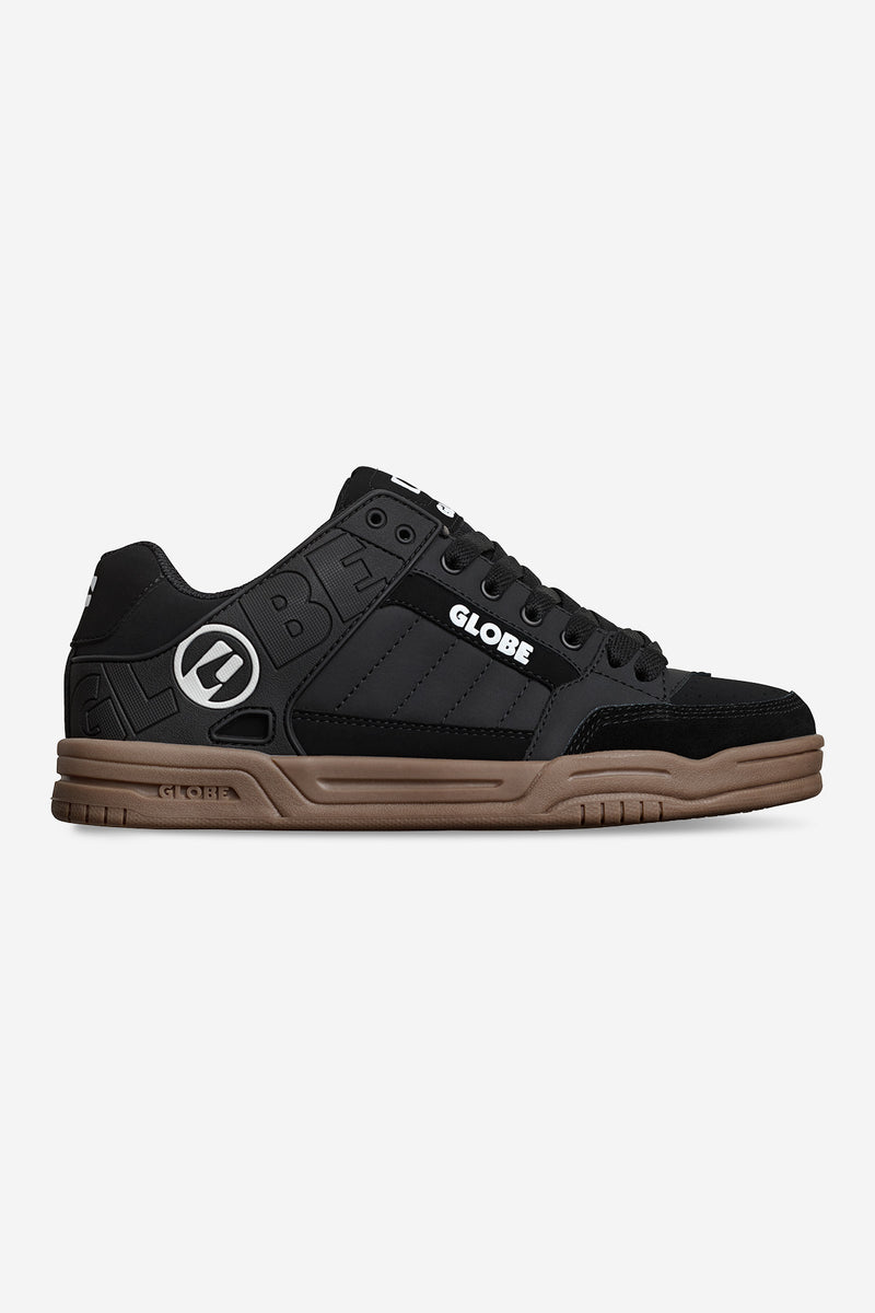 Side view of Globe Tilt sneaker in Onyx black with a tan gum sole and Globe branding