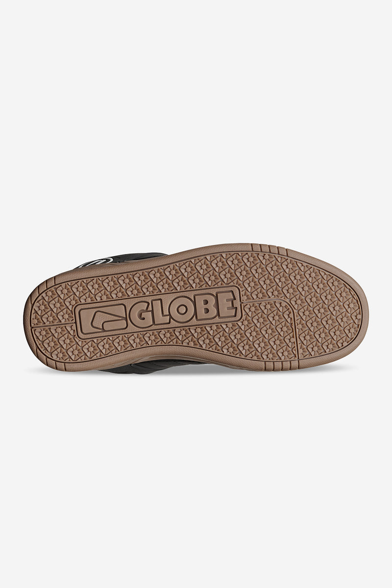Bottom view of the Globe Tilt outsole in gum with a patterned tread and Globe logo