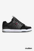 Side view of Tilt Prime black leather skate shoe with white midsole and red accents