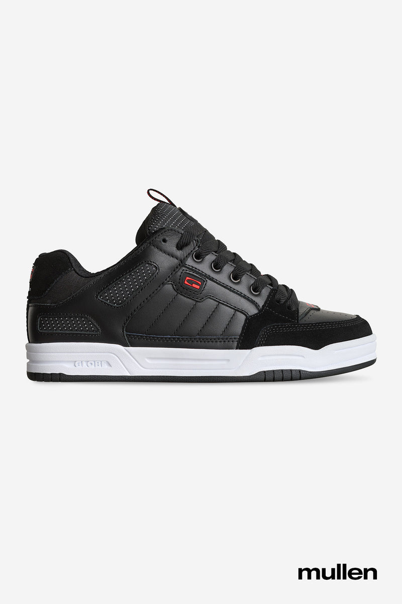 Side view of Tilt Prime black leather skate shoe with white midsole and red accents