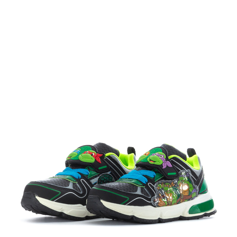 Toddler pair of black sneakers with neon green laces and TMNT art