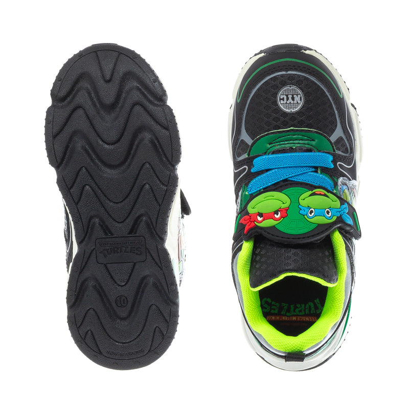 Toddler sneakers: black rubber outsole and neon green inner lining