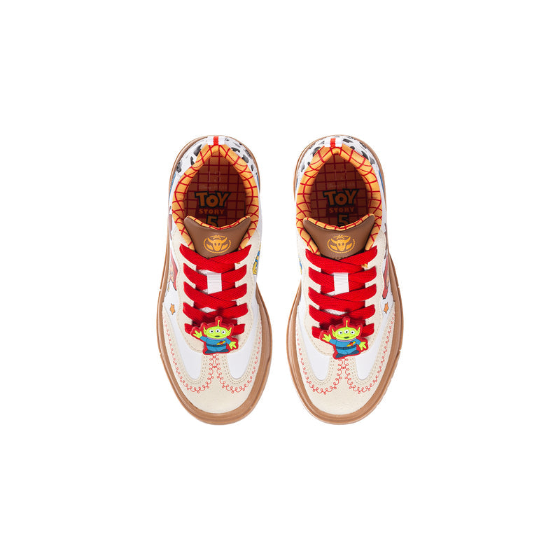 Kids sneakers with "TOY" printed insoles, red laces, white uppers, tan sole
