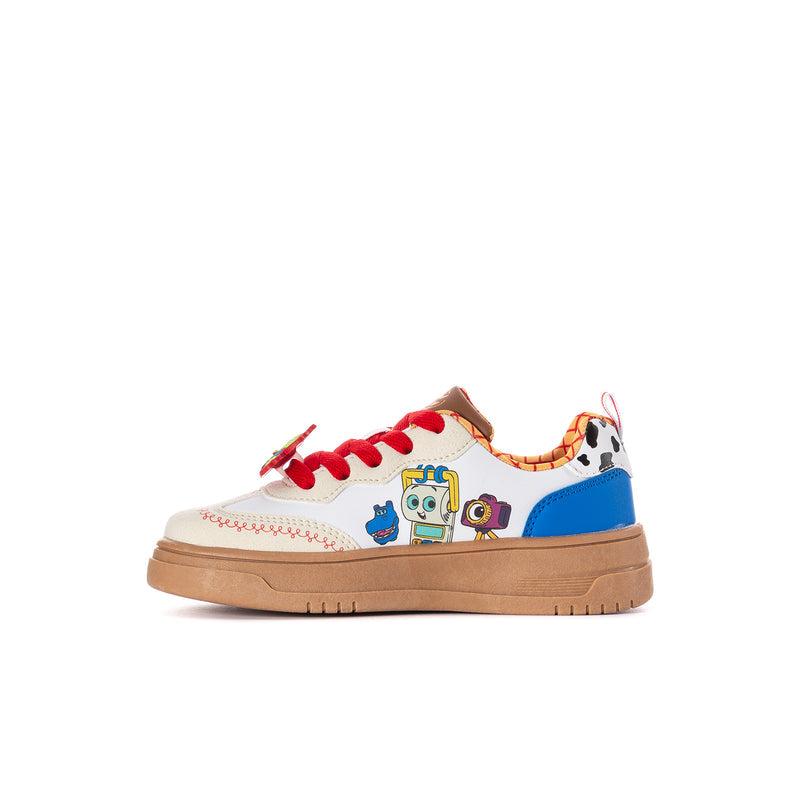 Kids sneaker side view with red laces, white uppers, colorful character graphics, tan sole
