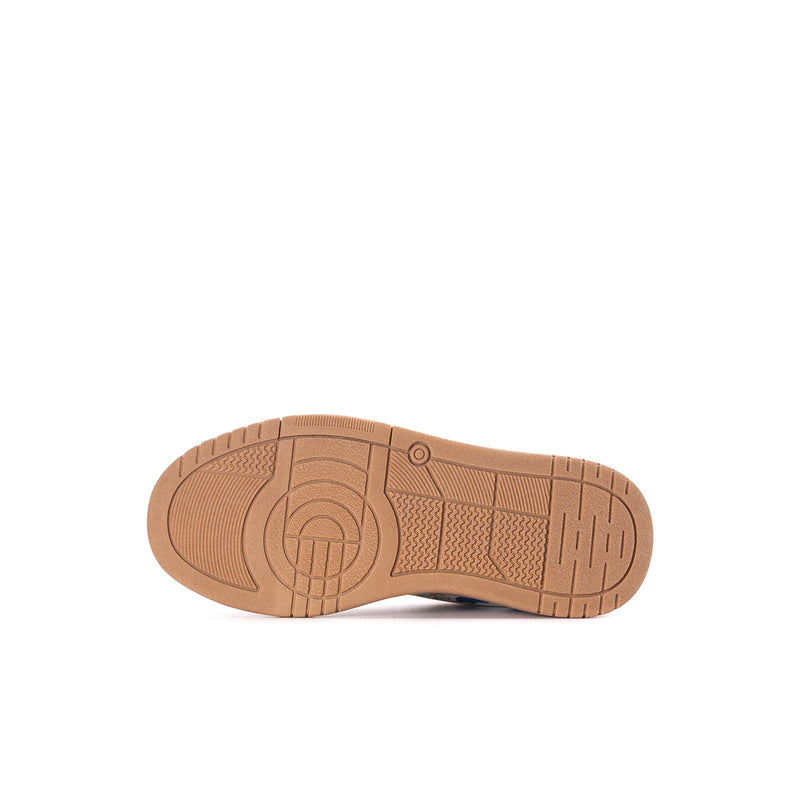 Kids sneaker outsole with textured tan rubber tread