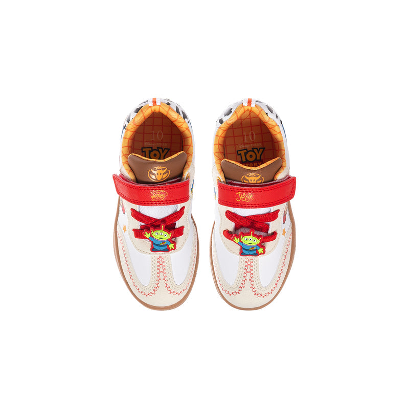 Toddler sneaker heel view with red strap, orange lining, and character graphic on white upper