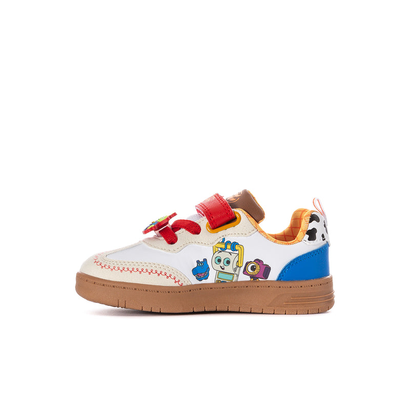 Toddler sneaker with white upper, blue side panel, red straps, and colorful character patch