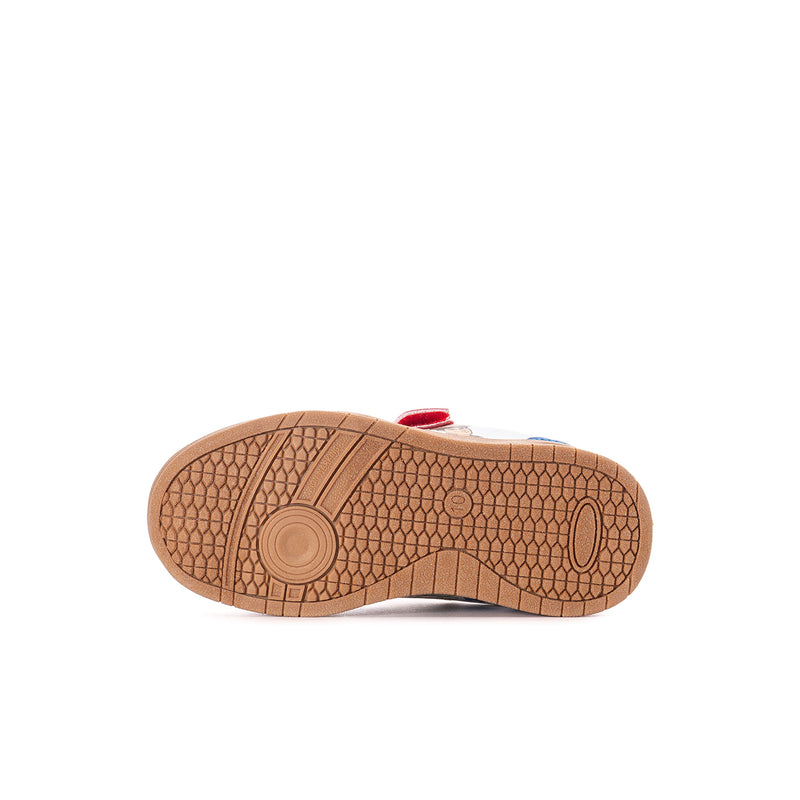 Toddler sneaker outsole underside in tan rubber with grid tread pattern