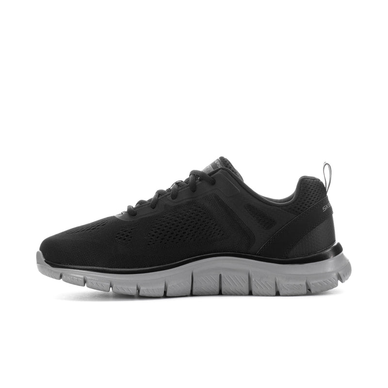 Men's wide black lace-up running shoe with mesh panels and thick gray traction sole