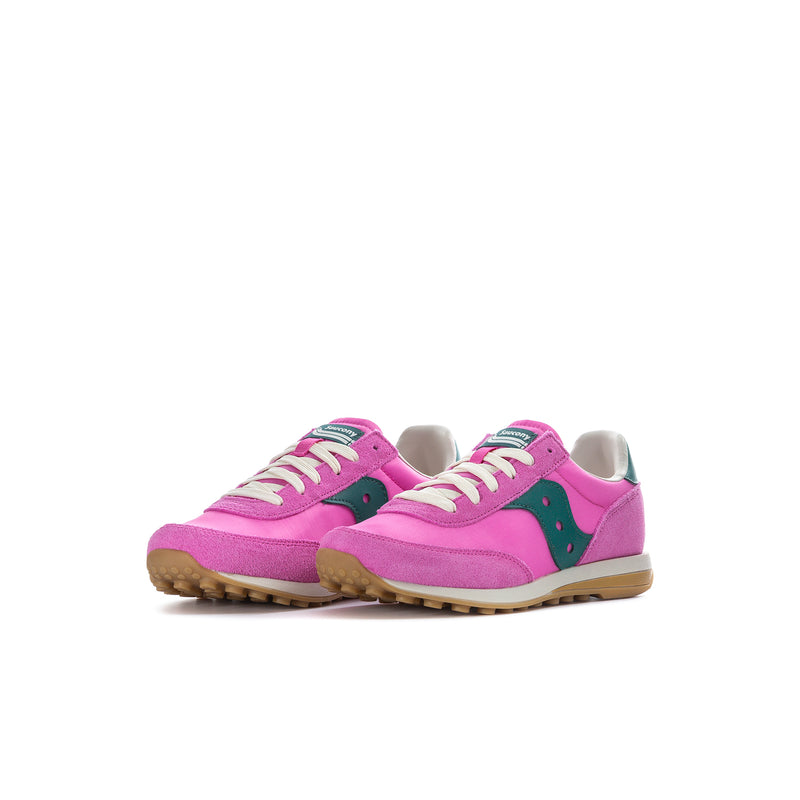 Kids pink sneakers, side view with teal logo patch and textured gum sole