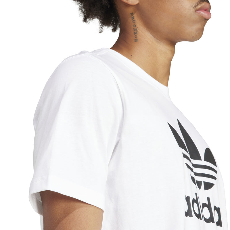White T-shirt side profile with partial adidas trefoil graphic