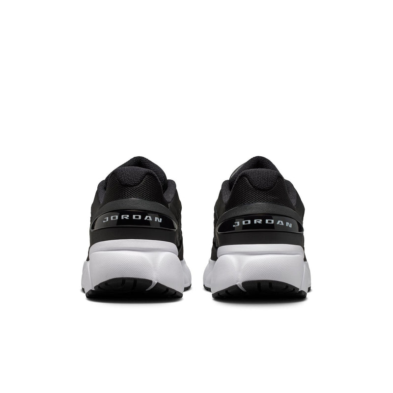 Women’s black sneakers with rear pull tabs and white heel midsole accents