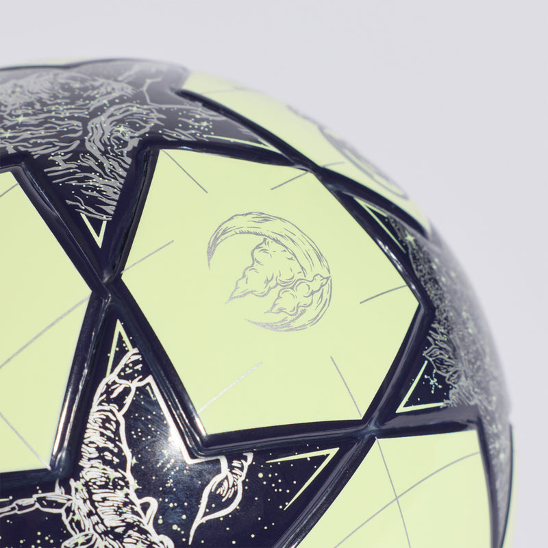 Close-up mini football panel, lime with Real Madrid lion crest and dark outline graphics.