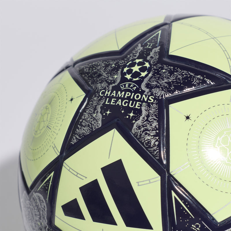 Mini football with Champions League star badge and three blue stripes on lime and navy cover.