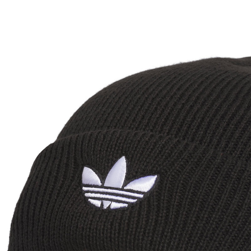 Close-up of black beanie knit with white trefoil logo embroidery