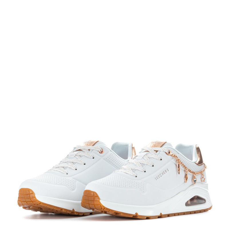 Pair of youth white sneakers with rose-gold lace charms and air window sole