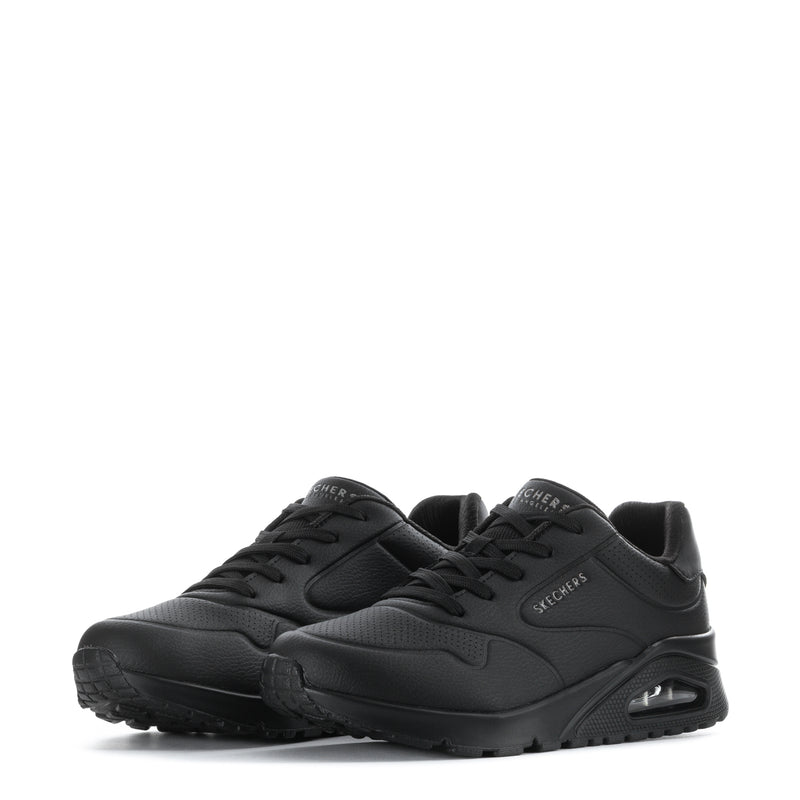 Pair of women's black SKECHERS lace-up sneakers with logo accents