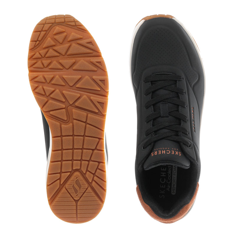 Shoe outsole and side view, textured tan tread with black upper and laces